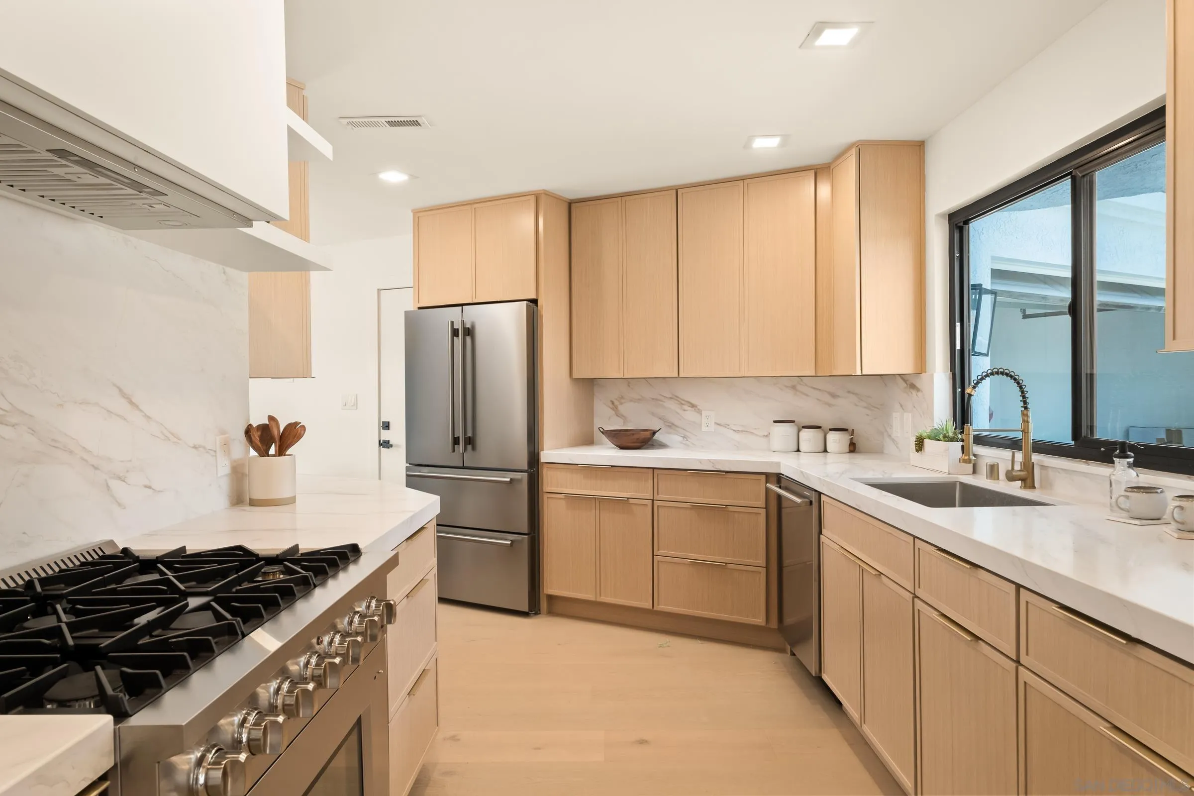 15032 Heath Drive Poway, CA 92064 - Photo 8 of 67 a kitchen with a sink stove and refrigerator