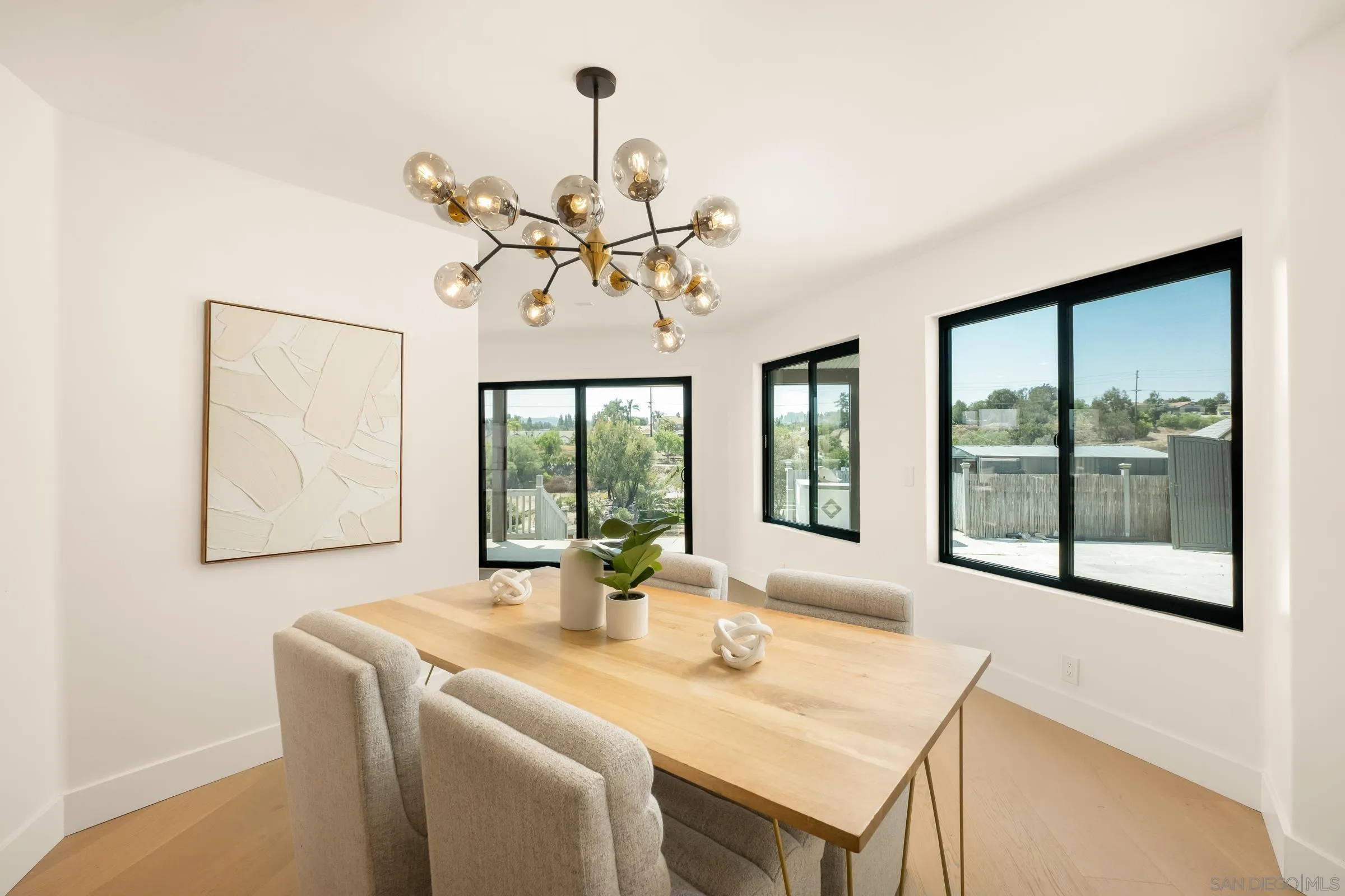15032 Heath Drive Poway, CA 92064 - Photo 10 of 67 a view of a dining room with furniture a chandelier and a large window