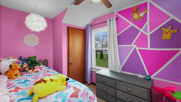 a room that has a bed and a dresser in it
