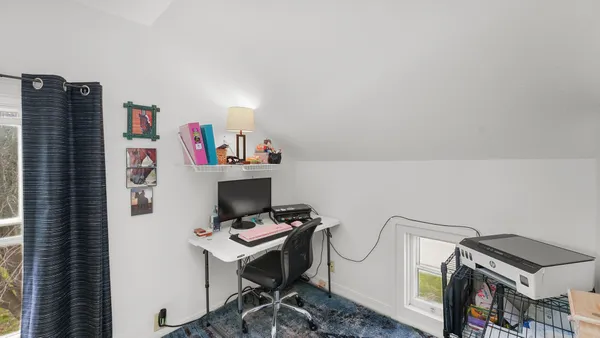 a workspace with furniture and book shelf