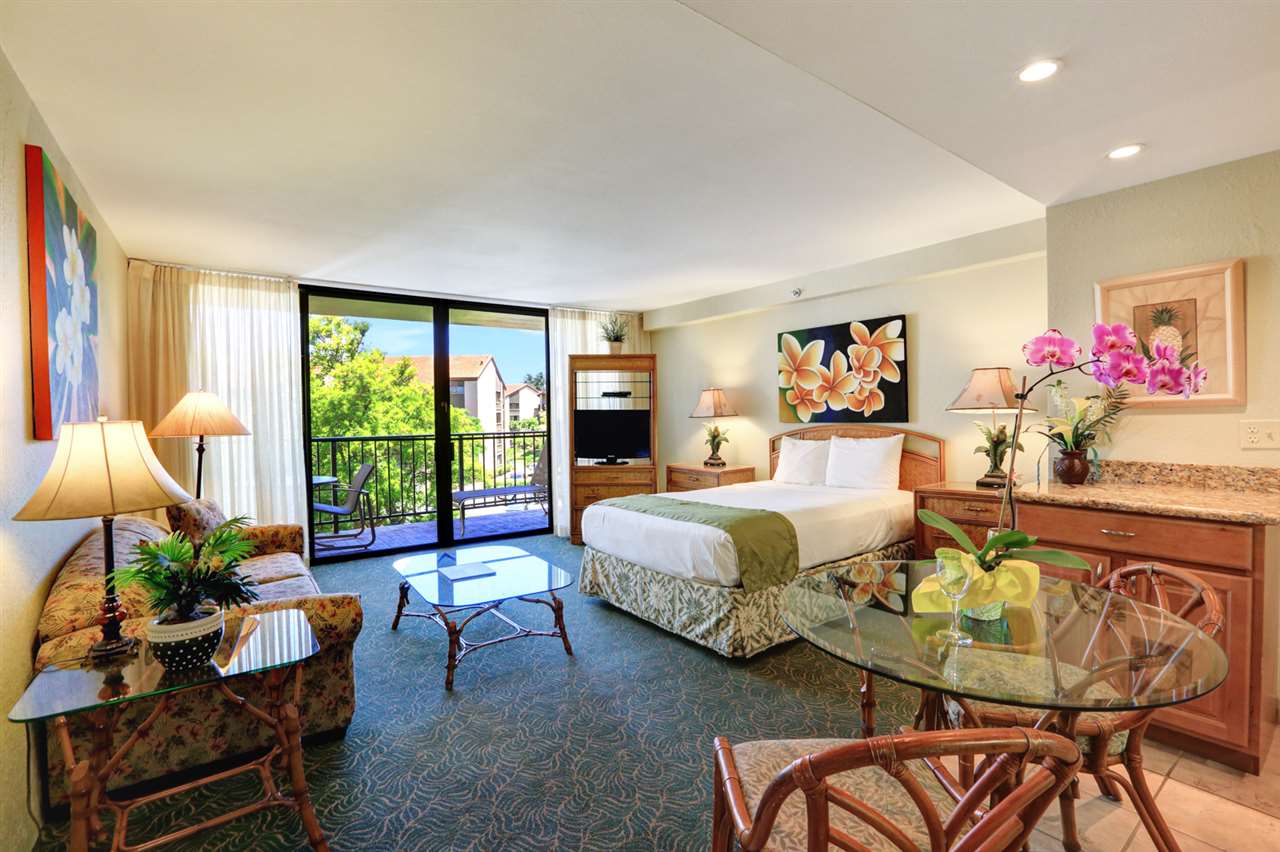 3445 Lower Honoapiilani Road, Unit 336 Lahaina, HI 96761 - Photo 1 of 22 a bedroom with a bed and large windows