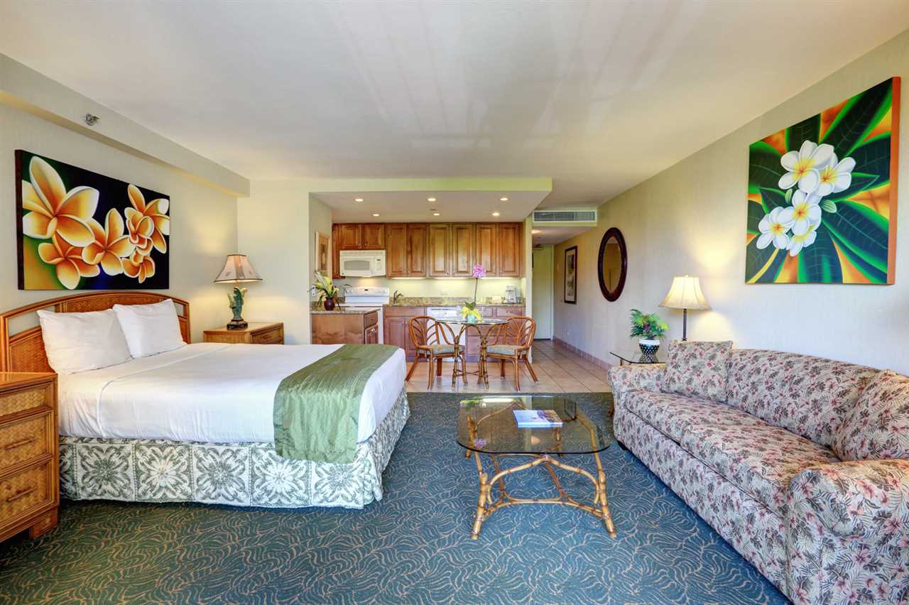 3445 Lower Honoapiilani Road, Unit 336 Lahaina, HI 96761 - Photo 6 of 22 a living room with furniture and a large window