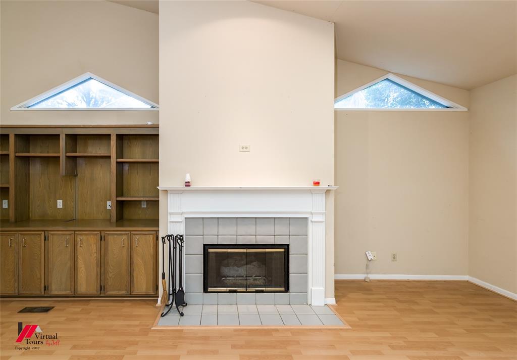 300 Pierremont Road, Unit 40 Shreveport, LA 71106 - Photo 20 of 34 Gas log Fireplace in living area featuring a fireplace