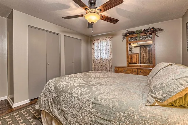 a bedroom with a bed and a chandelier