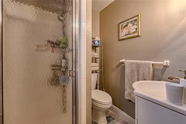a bathroom with a toilet and a sink