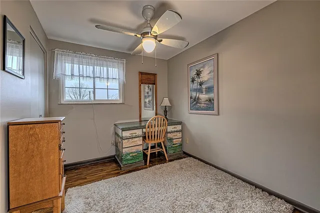 a view of workspace with window and ceiling fan