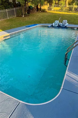 a view of a swimming pool with an ocean