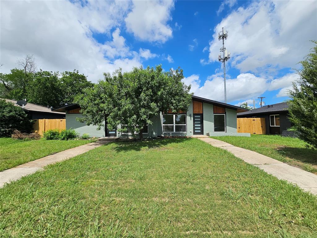 1725 R Avenue, Unit 1727 Plano, TX 75074 - Photo 20 of 20 Contemporary-style residence featuring a sloped roofline and light green exterior