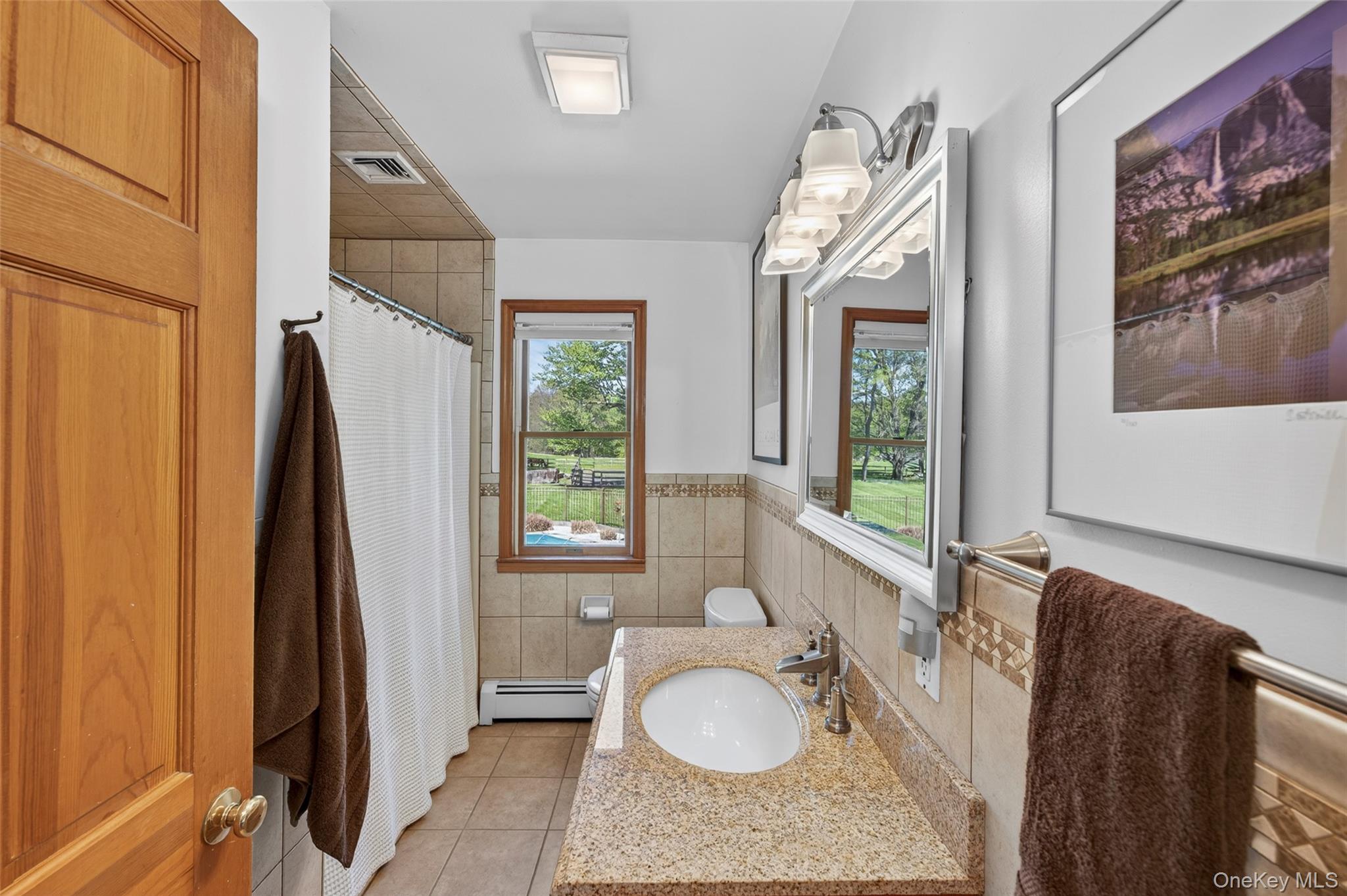 114 Last Road Middletown, NY 10941 - Photo 26 of 50 Main floor full bathroom featuring tile with decorative border and granite counter