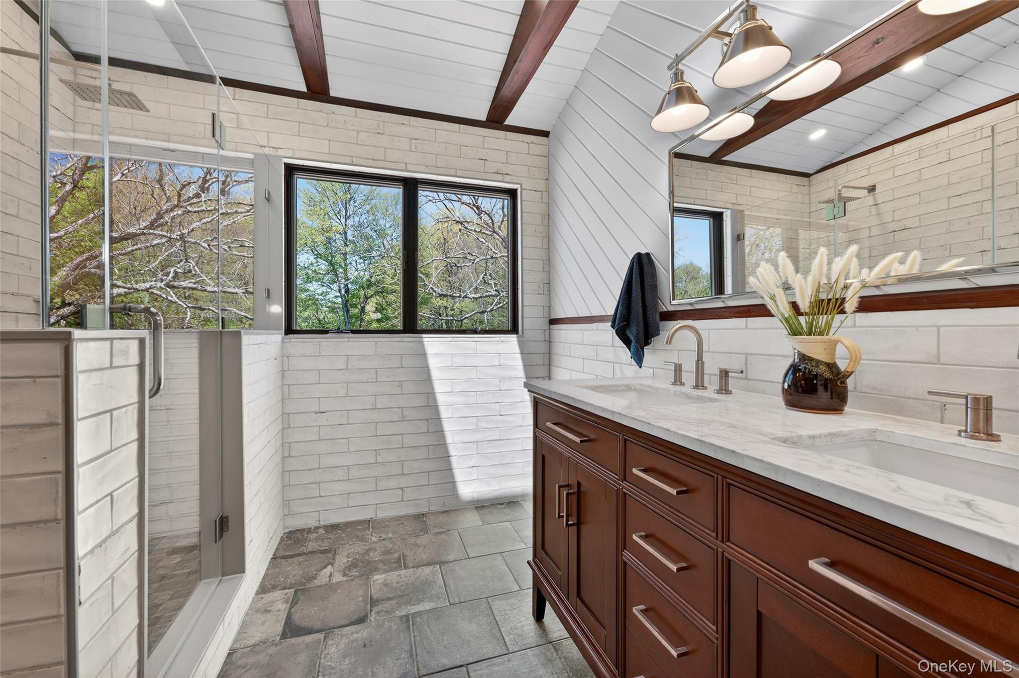 114 Last Road Middletown, NY 10941 - Photo 32 of 50 The spa-like primary en suite features distressed subway tile, open ceilings with wood beams and double sinks