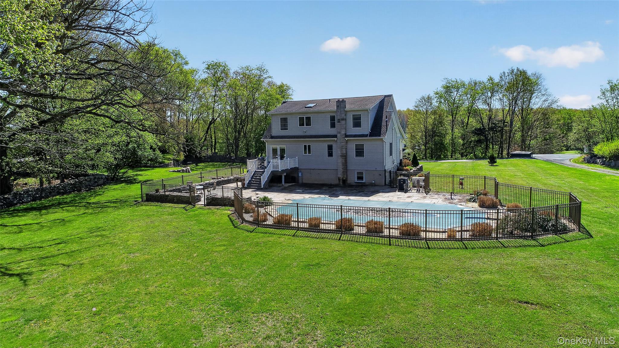 114 Last Road Middletown, NY 10941 - Photo 10 of 50 Surrounded by a classic fence and tall grasses, the pool area is ground zero for summer fun!