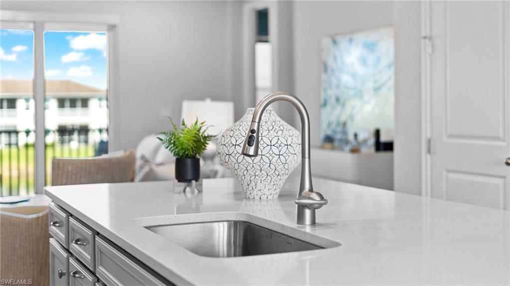 4601 Arboretum Circle, Unit 202 Naples, FL 34112 - Photo 13 of 37 a close view of sink and tap