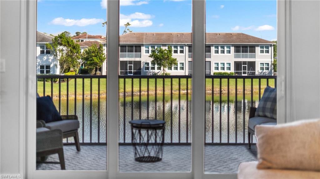 4601 Arboretum Circle, Unit 202 Naples, FL 34112 - Photo 18 of 37 a view of a balcony with chairs