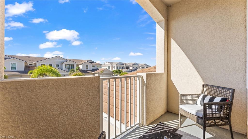4601 Arboretum Circle, Unit 202 Naples, FL 34112 - Photo 28 of 37 a view of a balcony with wooden floor
