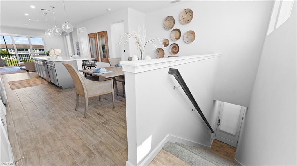 4601 Arboretum Circle, Unit 202 Naples, FL 34112 - Photo 3 of 37 a view of kitchen with furniture and a potted plant