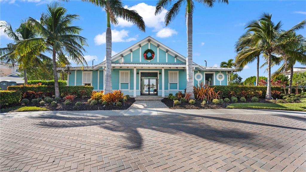 4601 Arboretum Circle, Unit 202 Naples, FL 34112 - Photo 33 of 37 a view of a house with outdoor space and palm trees
