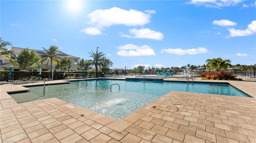 4601 Arboretum Circle, Unit 202 Naples, FL 34112 - Photo 34 of 37 a view of a lake with boats
