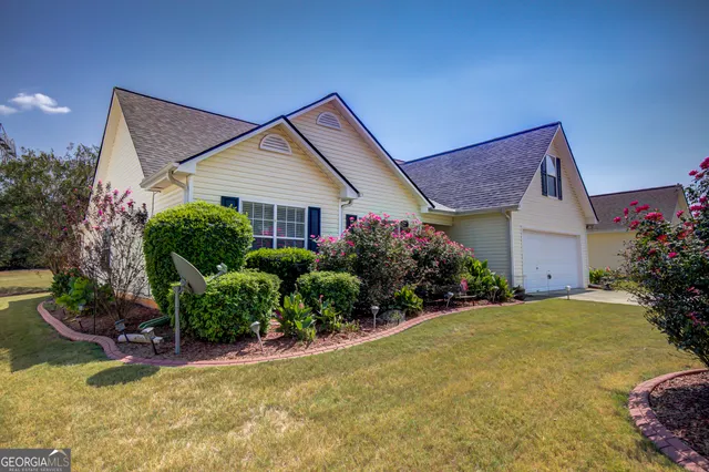 a front view of a house with garden