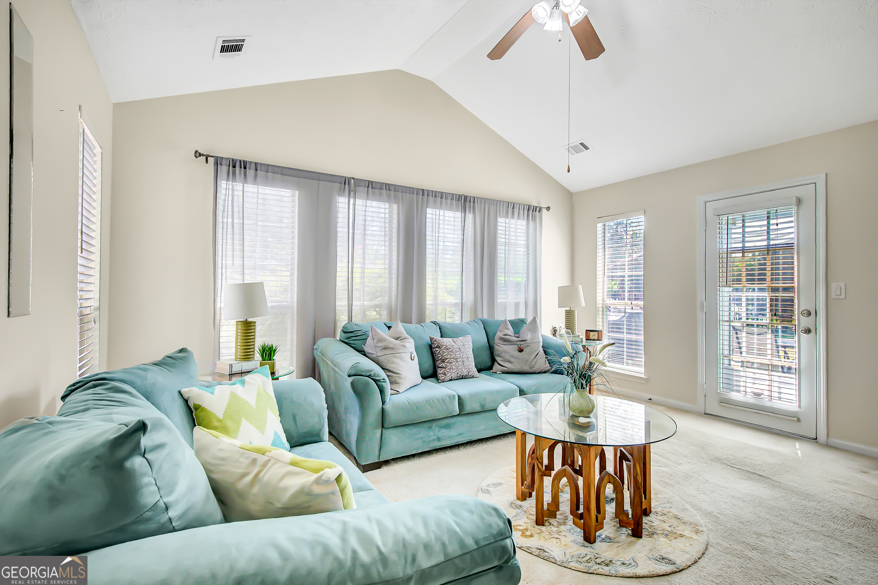 12350 Riviera Drive Fayetteville, GA 30215 - Photo 22 of 49 a living room with furniture and a large window