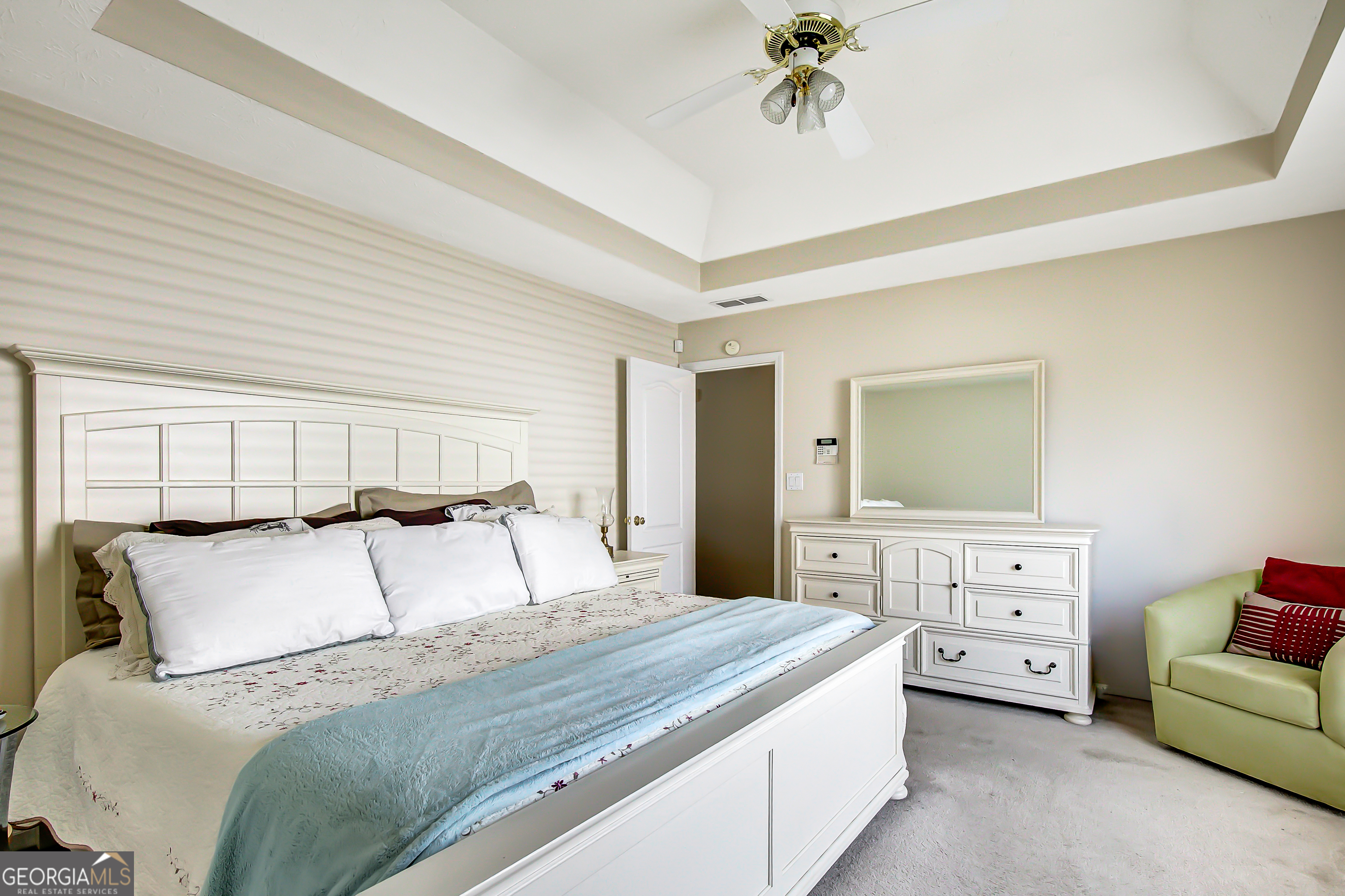 12350 Riviera Drive Fayetteville, GA 30215 - Photo 25 of 49 a bedroom with a bed and a couch