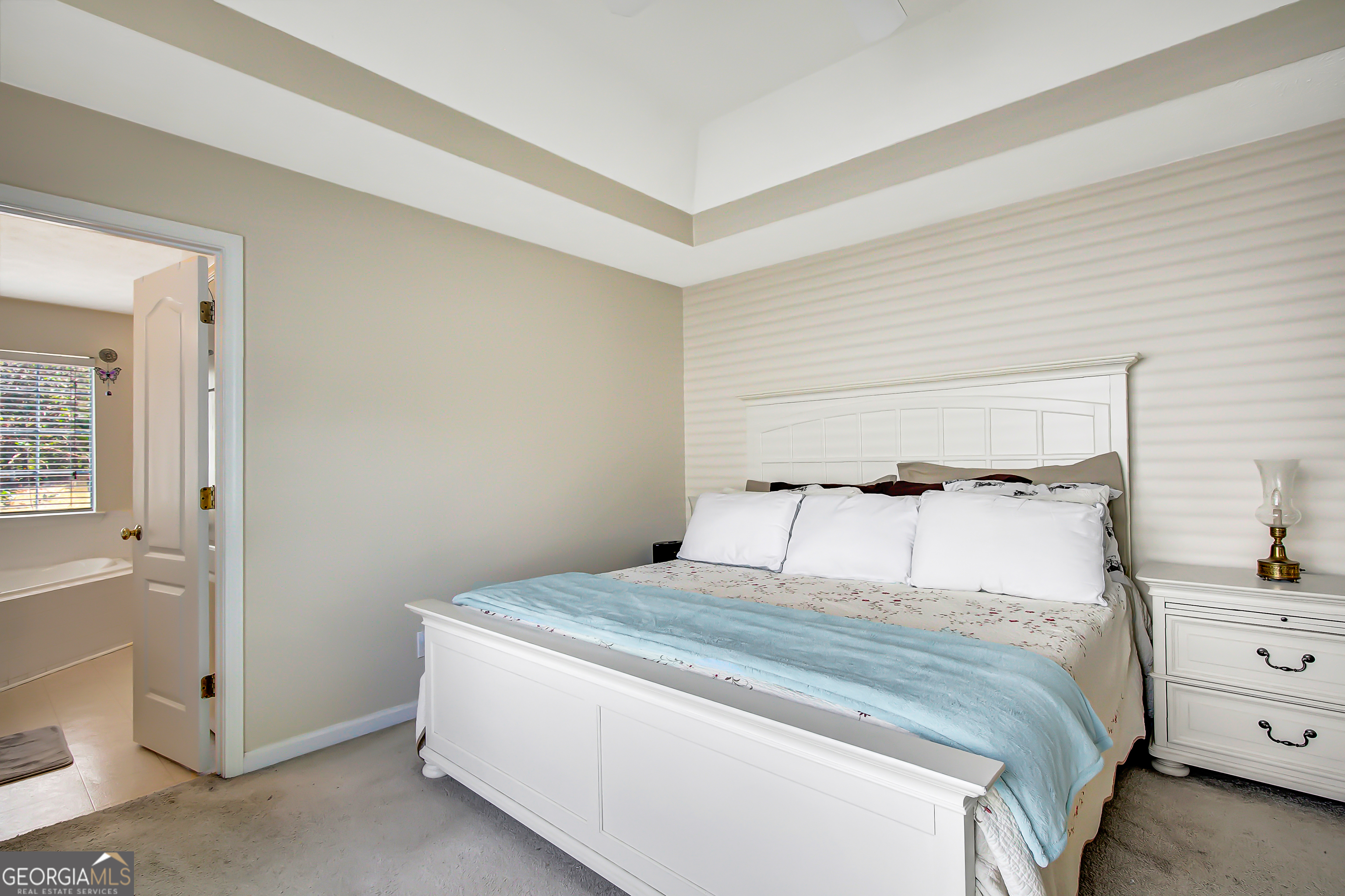 12350 Riviera Drive Fayetteville, GA 30215 - Photo 26 of 49 a bedroom with a bed and window