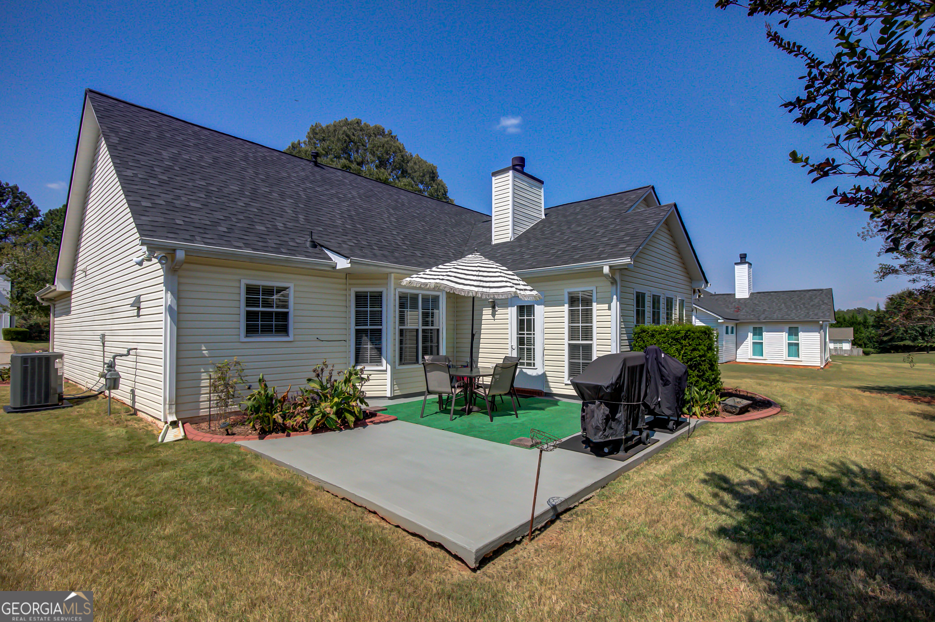 12350 Riviera Drive Fayetteville, GA 30215 - Photo 38 of 49 a front view of house with yard outdoor seating and green space
