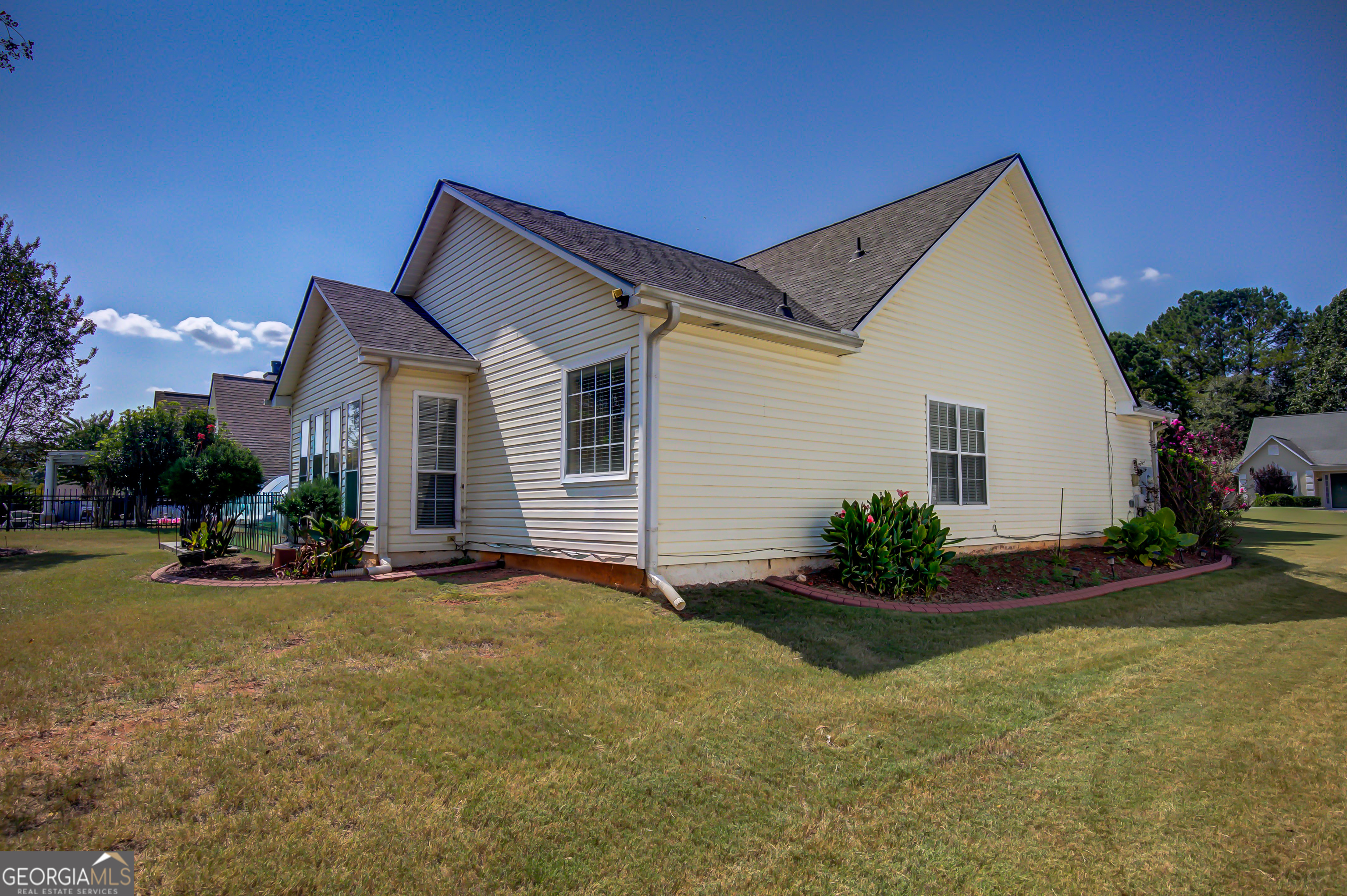 12350 Riviera Drive Fayetteville, GA 30215 - Photo 39 of 49 a view of a house with backyard and garden