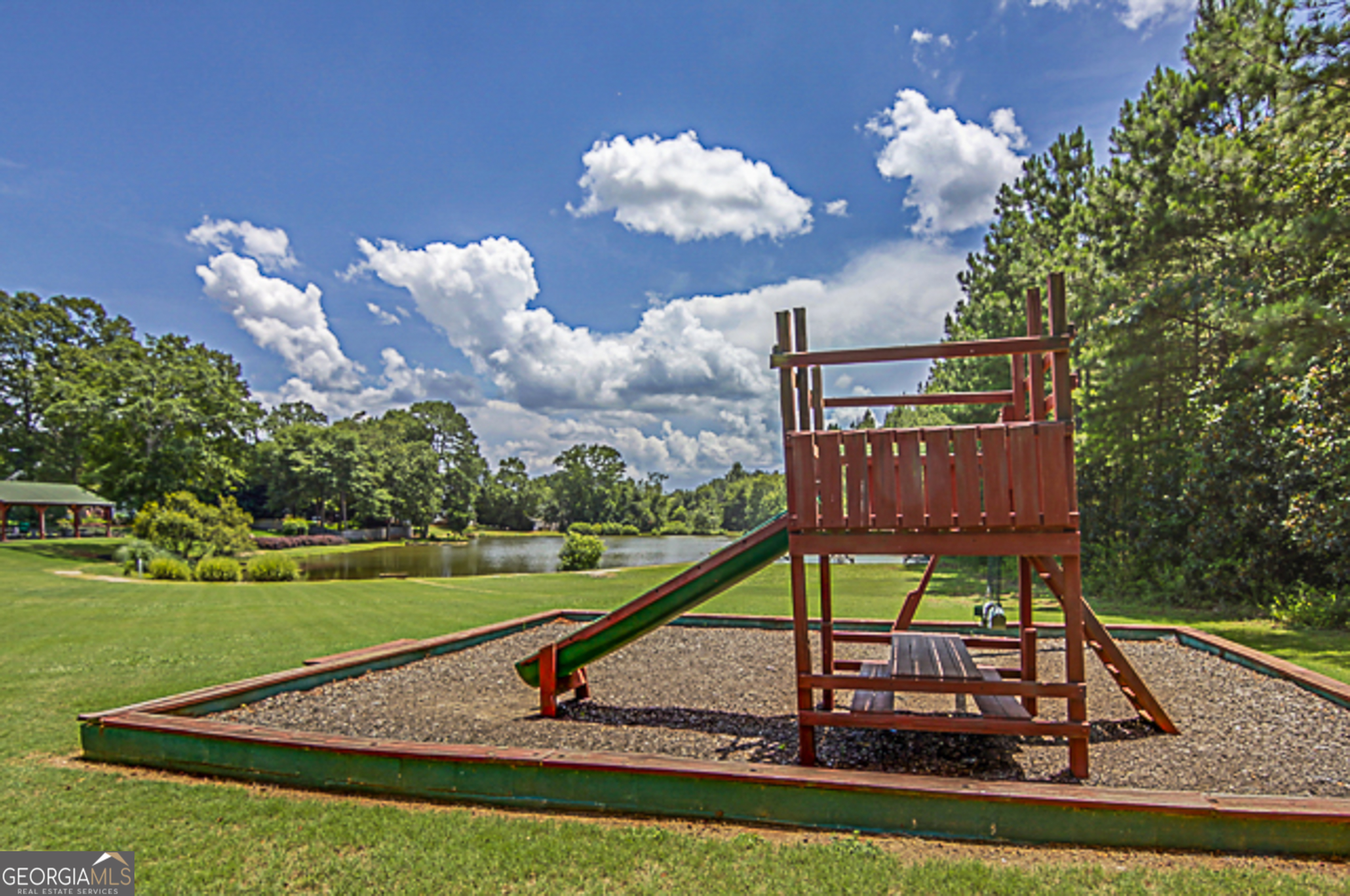 12350 Riviera Drive Fayetteville, GA 30215 - Photo 44 of 49 a view of a house with backyard and a slide