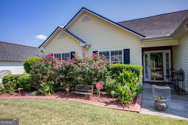 a front view of a house with a yard