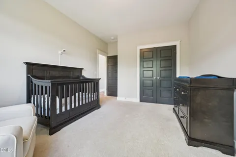 a bed room with a bed and a window