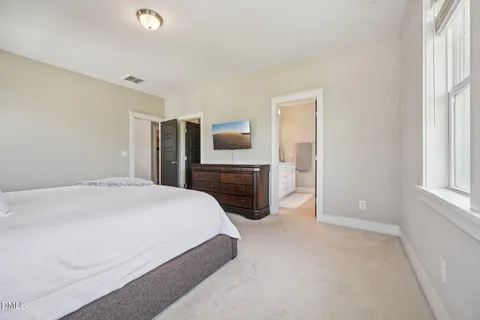 a spacious bathroom with a double vanity sink mirror and double