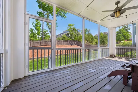 a view of living room with wooden floor and furniture