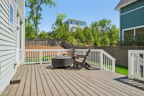 a view of house with backyard and swimming pool