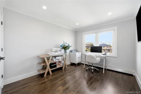 a workspace with furniture and wooden floor