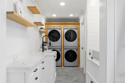 a view of a hallway with washer and dryer