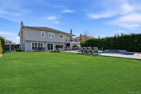 a view of house with a yard