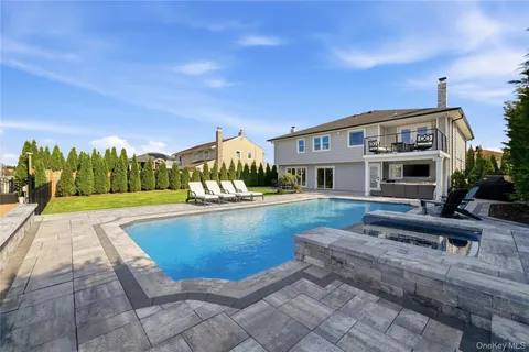 a view of house with swimming pool yard fire pit and outdoor seating