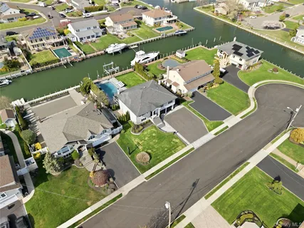 an aerial view of a house with a ocean view