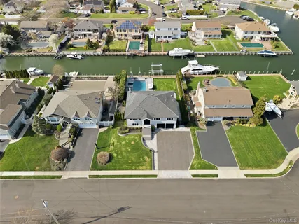 an aerial view of a house with a garden potted plants and large trees
