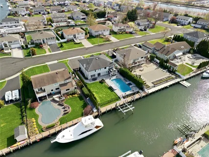 an aerial view of a city with lake