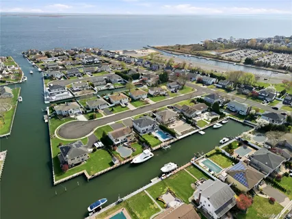 an aerial view of a house with a ocean view