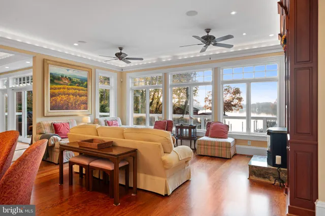 a kitchen with stainless steel appliances granite countertop a sink a stove and a wooden floors