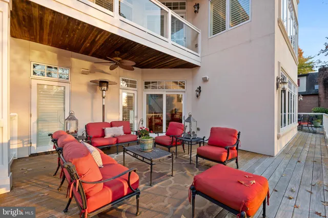 a view of a patio with table and chairs and potted plants