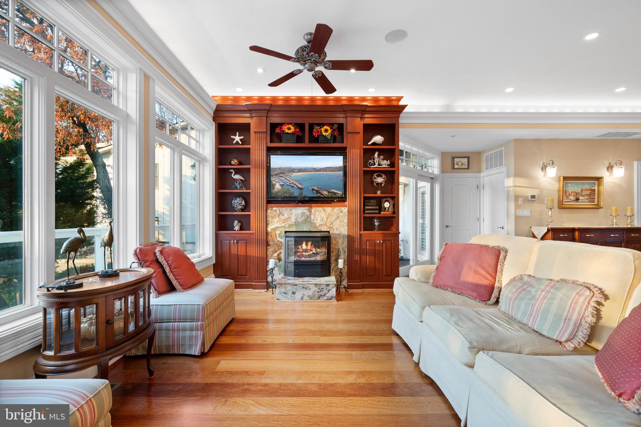 206 Harbor Drive Lusby, MD 20657 - Photo 19 of 109 a living room with fireplace furniture and a large window