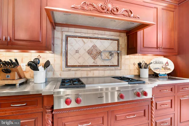 a bathroom with a tub a sink and a large mirror