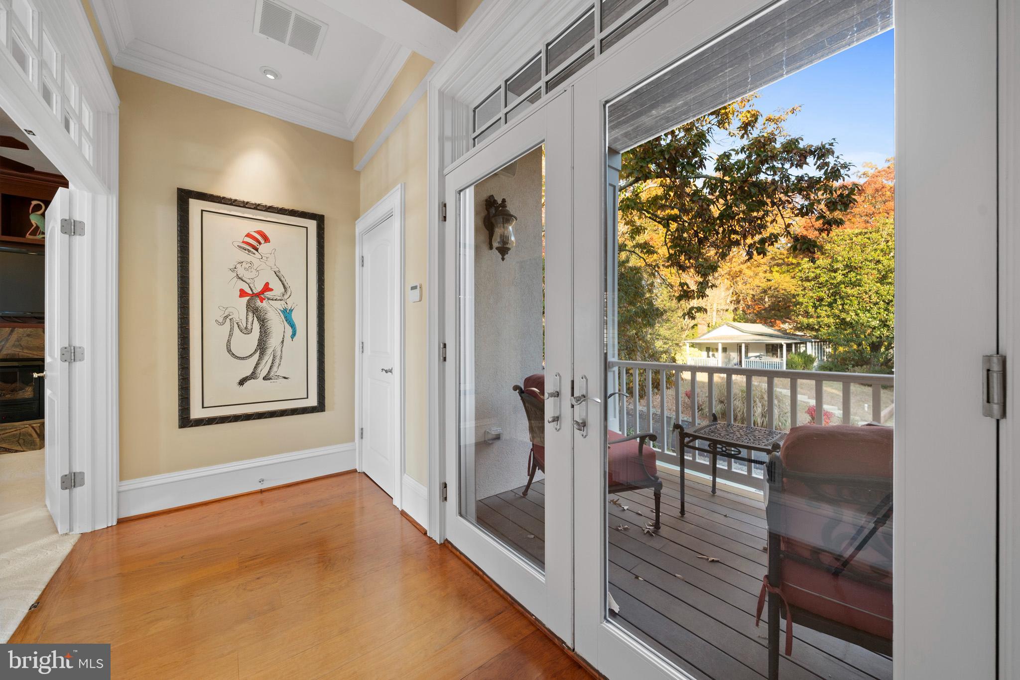 206 Harbor Drive Lusby, MD 20657 - Photo 37 of 109 a view of a hallway with wooden floor and dining room view
