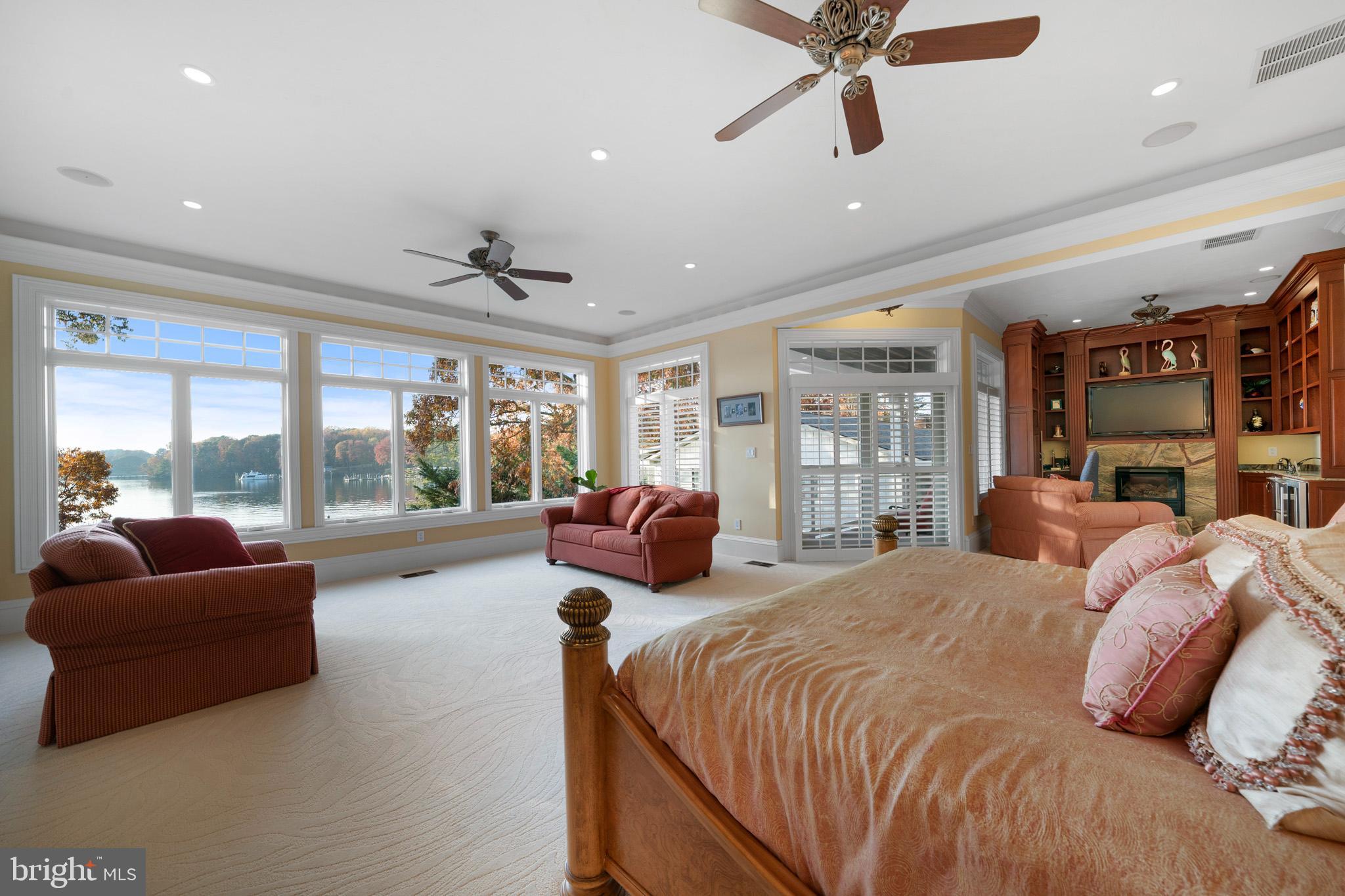 206 Harbor Drive Lusby, MD 20657 - Photo 39 of 109 a spacious bedroom with a bed and glass walk in closet