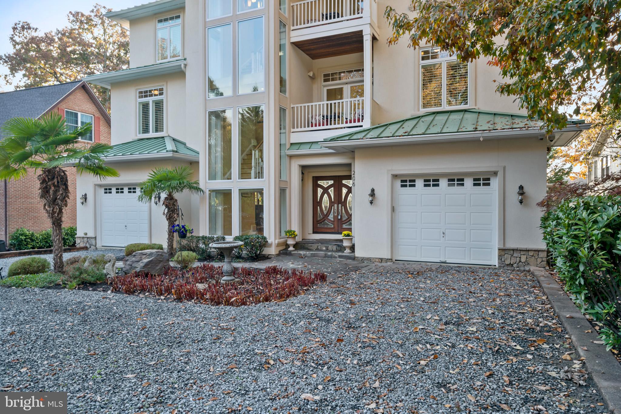 206 Harbor Drive Lusby, MD 20657 - Photo 4 of 109 a front view of a house with garden