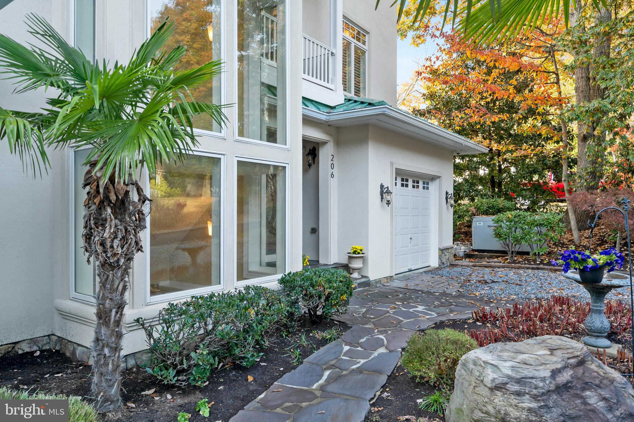 206 Harbor Drive Lusby, MD 20657 - Photo 6 of 109 a view of a house with a yard and potted plants