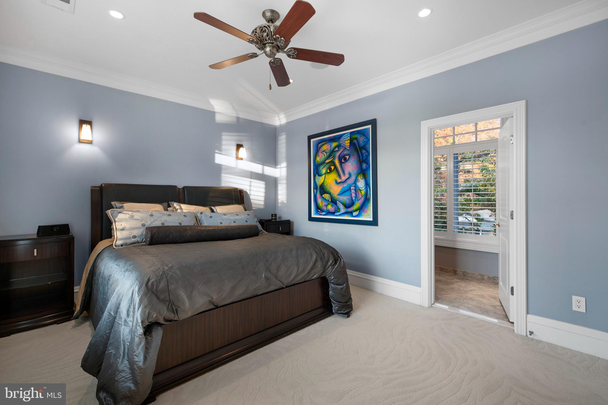 206 Harbor Drive Lusby, MD 20657 - Photo 61 of 109 a bedroom with a bed and ceiling fan